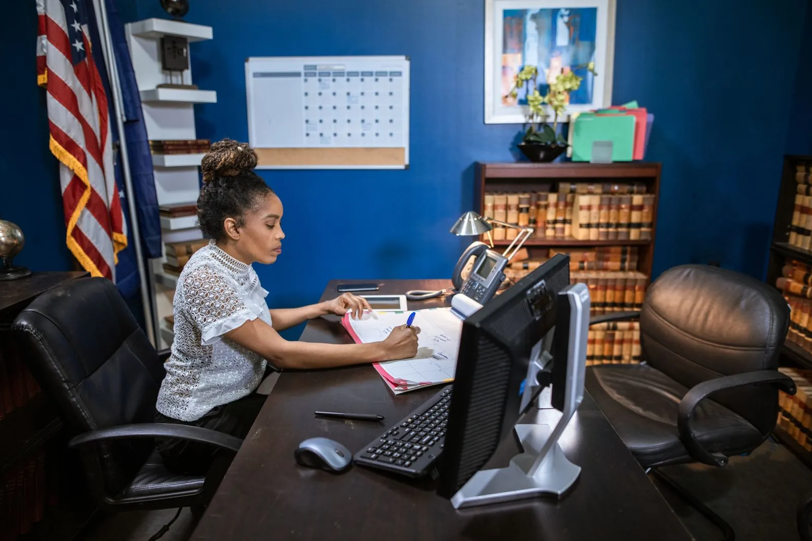 Legal professional working at a computer in a law office